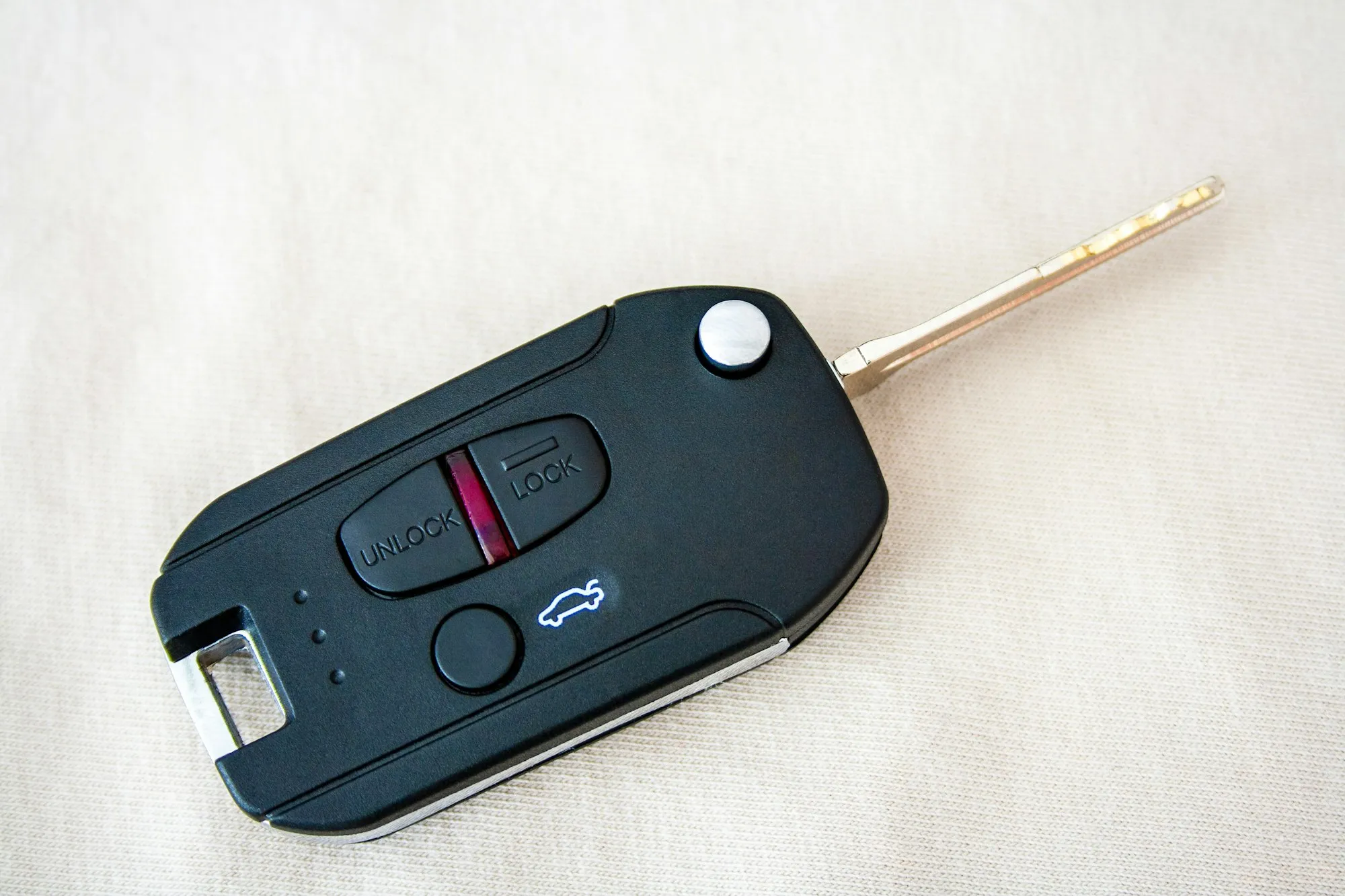 Car remote key fob with flip-out key blade