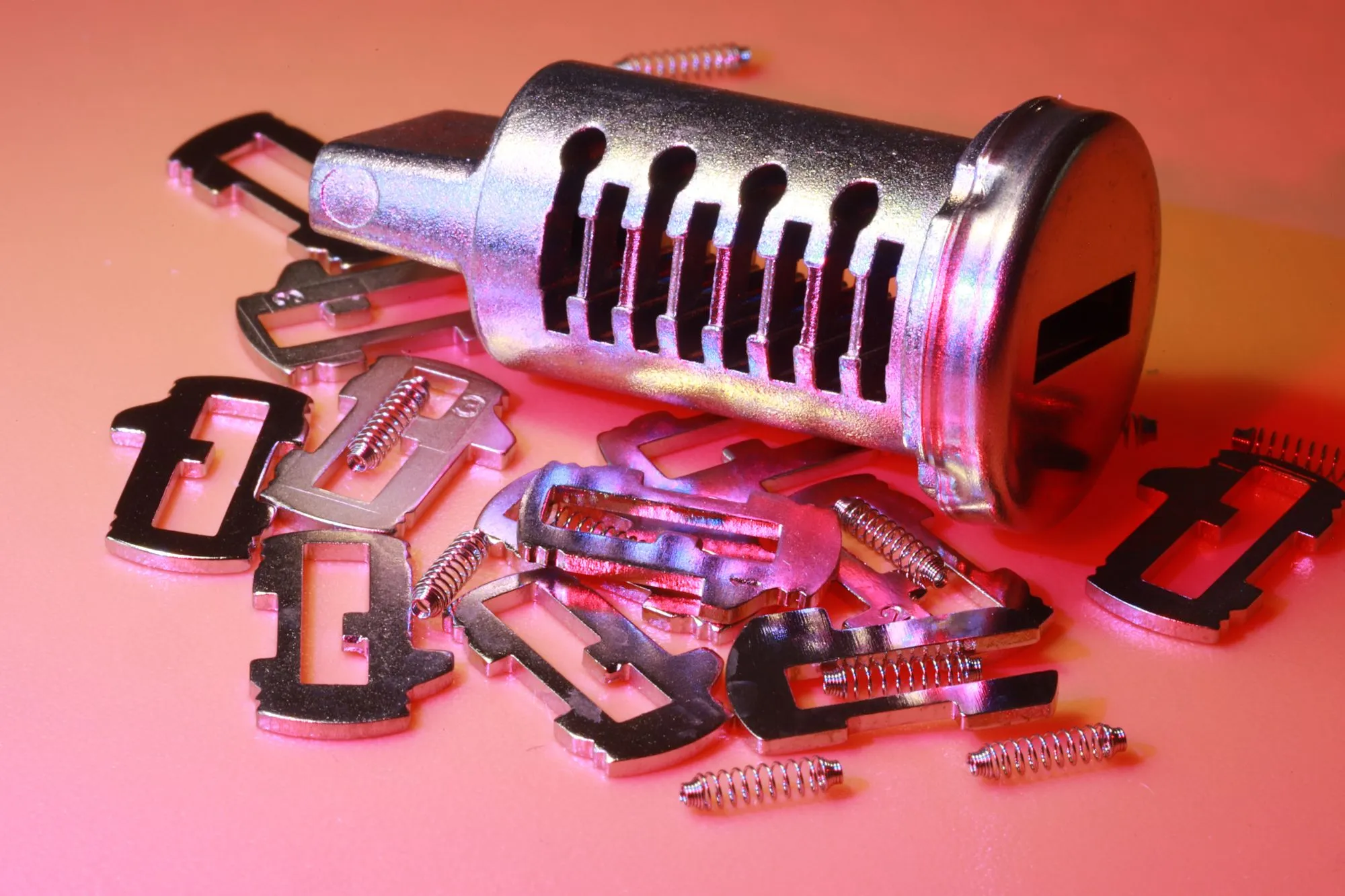 Disassembled lock cylinder with pins and springs during a rekey